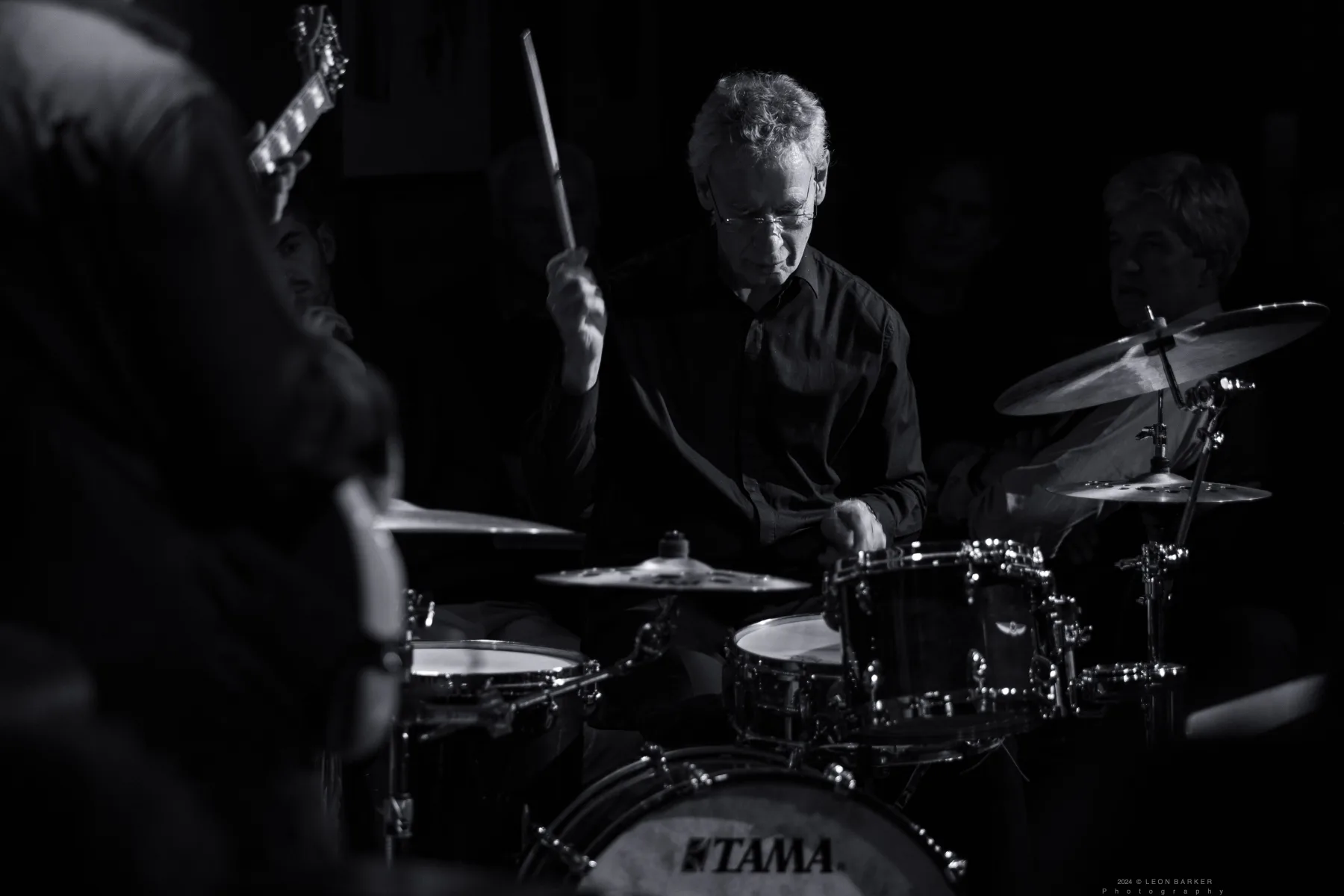 Pete Roth Trio playing a live jazz set in a dark venue.
